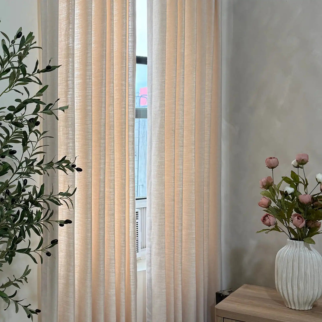 Light filtering test of Vanilla Cream Jasper Dotted Linen Blend Curtains showing 45% to 65% blackout effect
