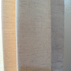 A close-up of the fabric texture of Jasper Dotted Linen Blend Curtains in Vanilla Cream, showcasing the slub weave.