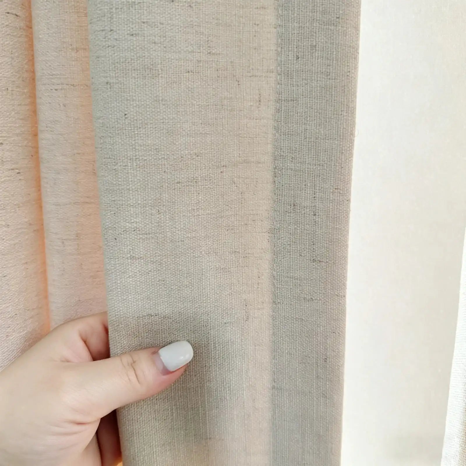 Textured fabric detail of Jasper Dotted Linen Blend Curtains in Vanilla Cream showing slub weave