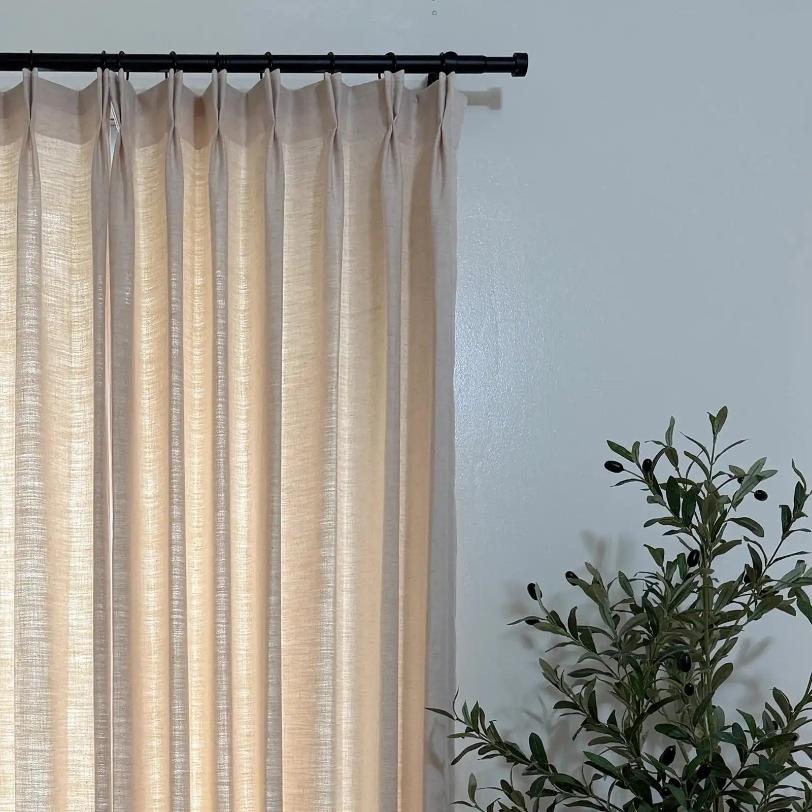 Pinch pleat header style of Jasper Dotted Linen Blend Curtains in Vanilla Cream on black rod