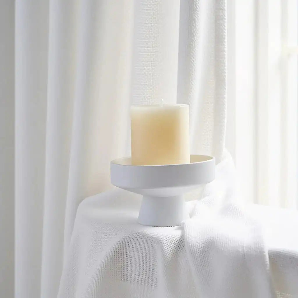 White John Linen Texture Cotton Curtains draped elegantly behind a minimal candle holder setup