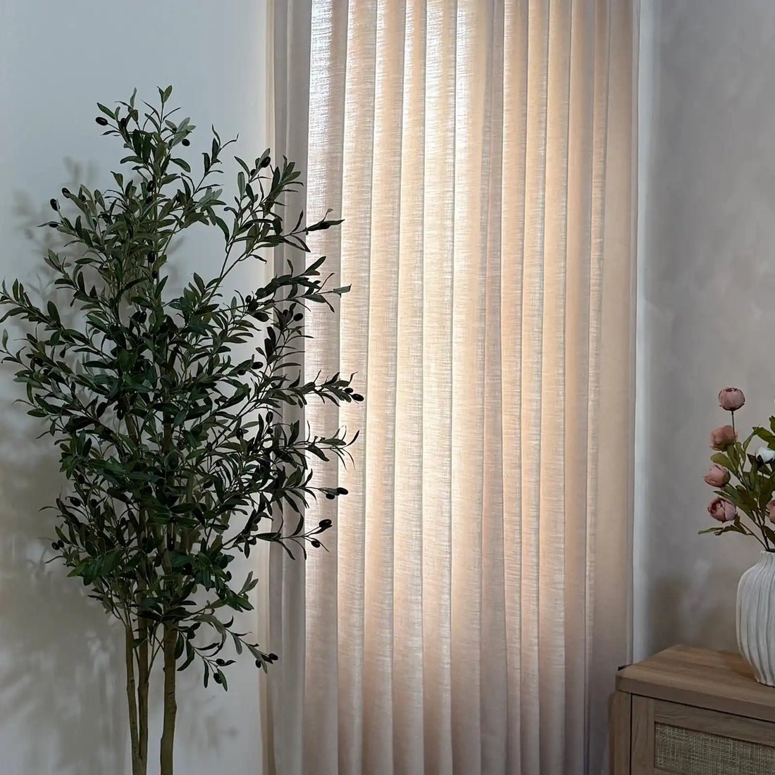 Close up of pleated Jasper Dotted Linen Blend Curtains in Vanilla Cream, neutral home interior
