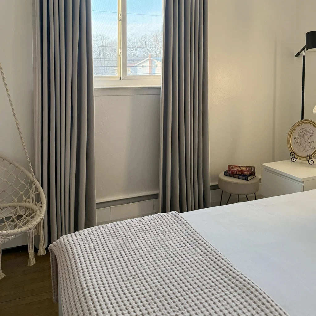 Minimalist home interior with textured Natural Beige Orion Linen Look Blackout Curtains drapery