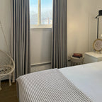 Minimalist home interior with textured Natural Beige Orion Linen Look Blackout Curtains drapery