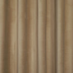 A detail shot showing the tailored heading and top rings of an Adrian Cashmere Blackout Curtain in Camel Yellow as it hangs from a brass rod.