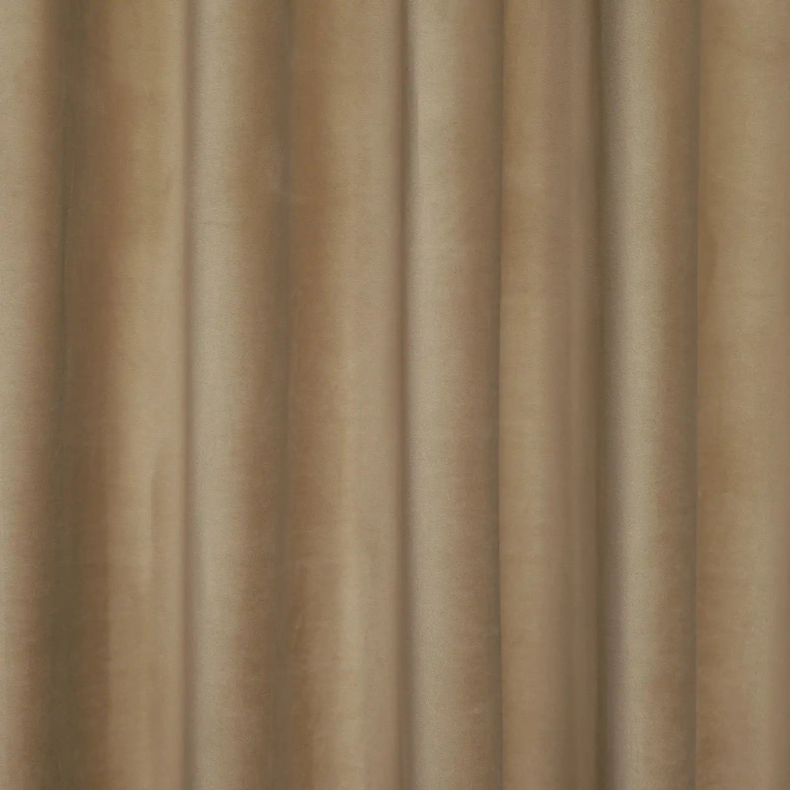 A detail shot showing the tailored heading and top rings of an Adrian Cashmere Blackout Curtain in Camel Yellow as it hangs from a brass rod.