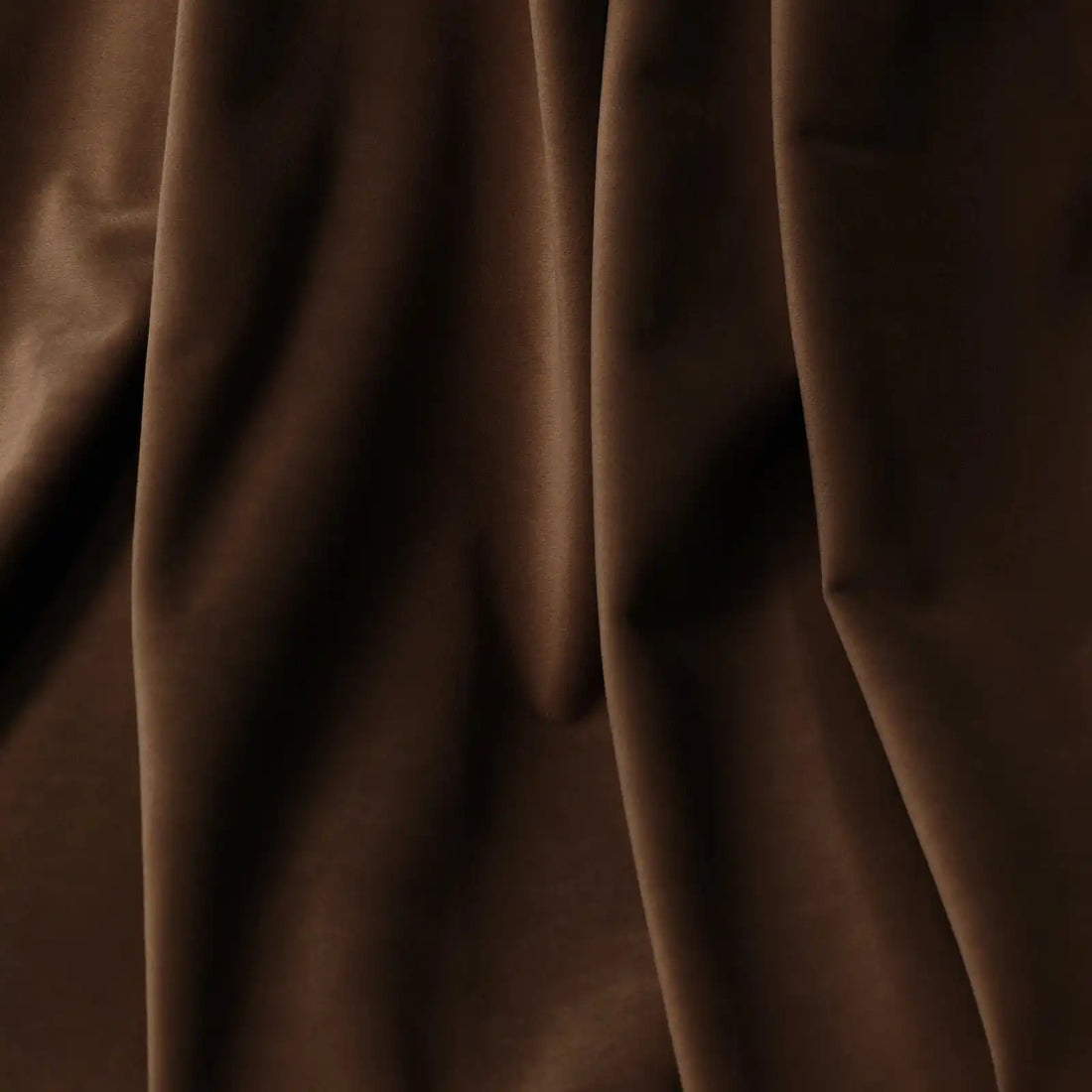 A detailed close-up of the deep brown material folding naturally, highlighting its ultra-soft, velvet-like texture and subtle matte finish.