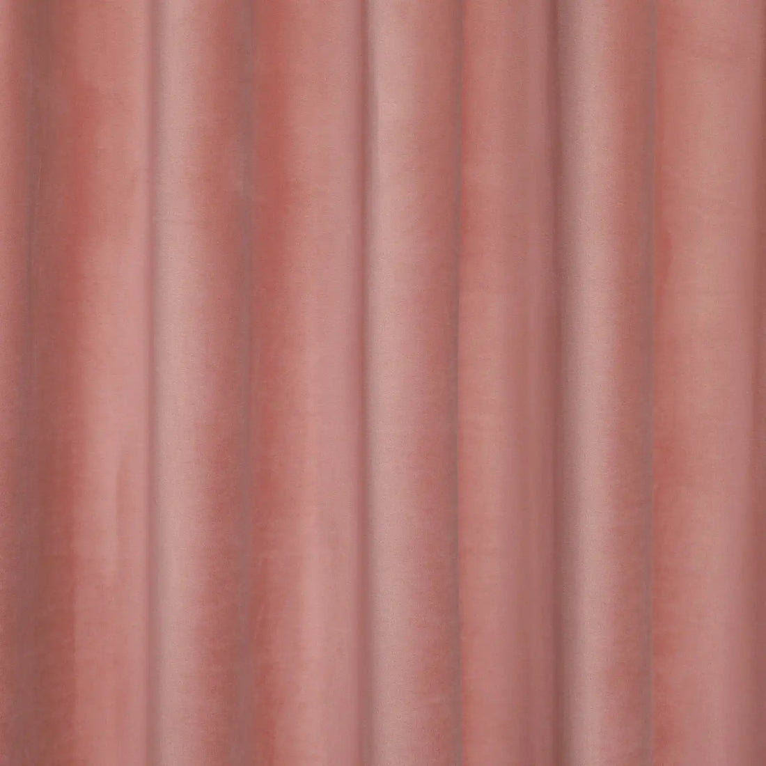A tight, detailed shot capturing the crisp, uniform vertical pleats and neat drape of the pink blackout curtain.