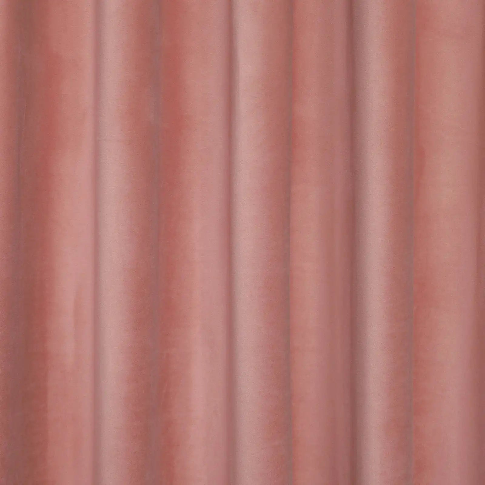 A tight, detailed shot capturing the crisp, uniform vertical pleats and neat drape of the pink blackout curtain.