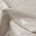 Close-up of beige Alex blackout curtain fabric with textured linen-look weave