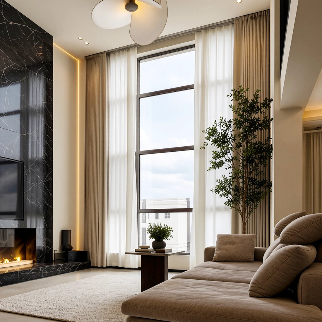 Beige Alex extra-long blackout curtains framing a high-ceiling living room with fireplace