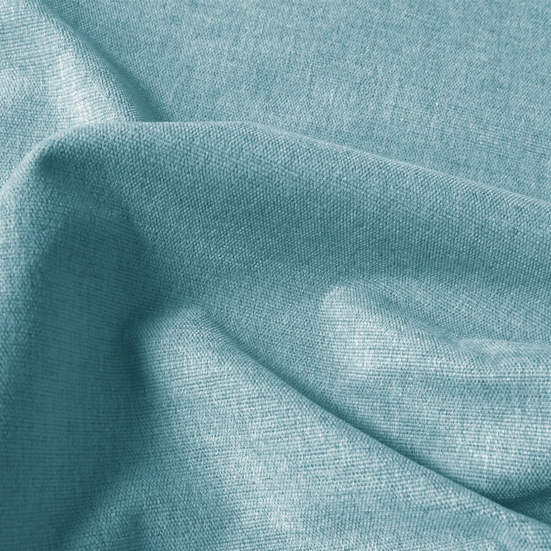 Close-up of light green Alex blackout curtain fabric with fine linen-look texture