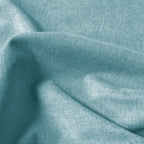 Close-up of light green Alex blackout curtain fabric with fine linen-look texture