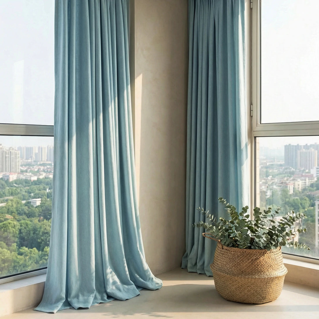 Tall light green Alex curtains adding soft color to a spacious contemporary lobby