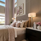 Light pink floor-to-ceiling Alex curtains beside a softly styled modern bed