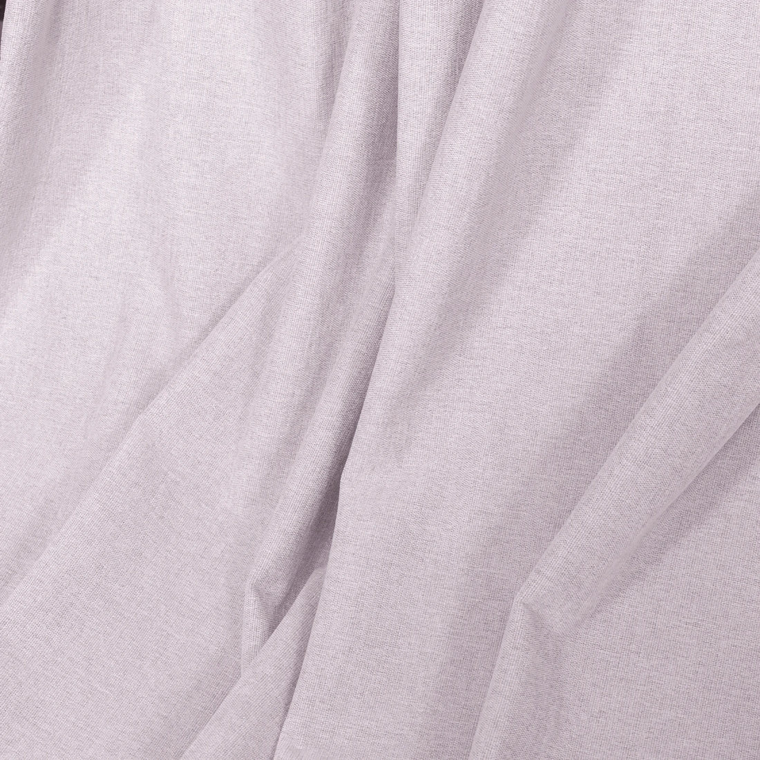 Light pink Alex curtain fabric arranged in soft folds for a linen-look finish