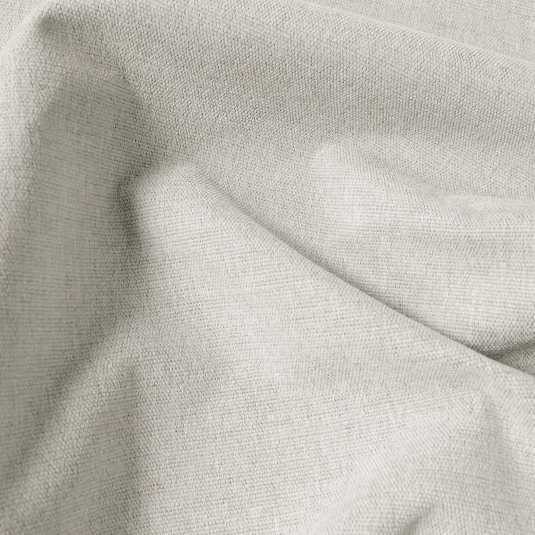 Macro detail of off-white Alex linen-look blackout curtain fabric in soft folds