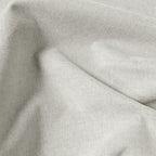 Macro detail of off-white Alex linen-look blackout curtain fabric in soft folds
