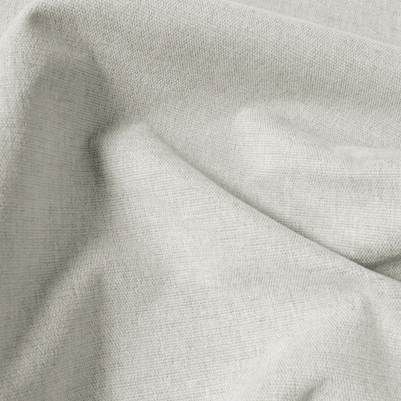 Macro detail of off-white Alex linen-look blackout curtain fabric in soft folds