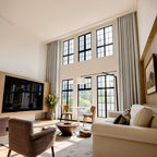 Off-white Alex floor-to-ceiling curtains in a sunlit contemporary living room