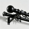 Heavy duty Black Bieber Custom Curtain Rod installation detail showing matte black finish close up