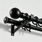 Heavy duty Black Bieber Custom Curtain Rod installation detail showing matte black finish close up