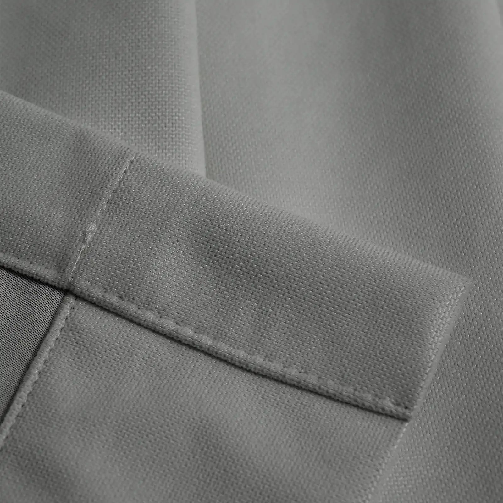 Close-up of cool gray Gavin curtain texture and tailored hem