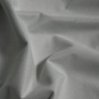 Macro detail of cool gray Gavin curtain fabric arranged in soft folds