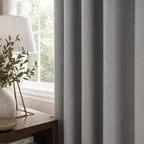 Cool gray Gavin curtains with soft pleats in a calm contemporary bedroom
