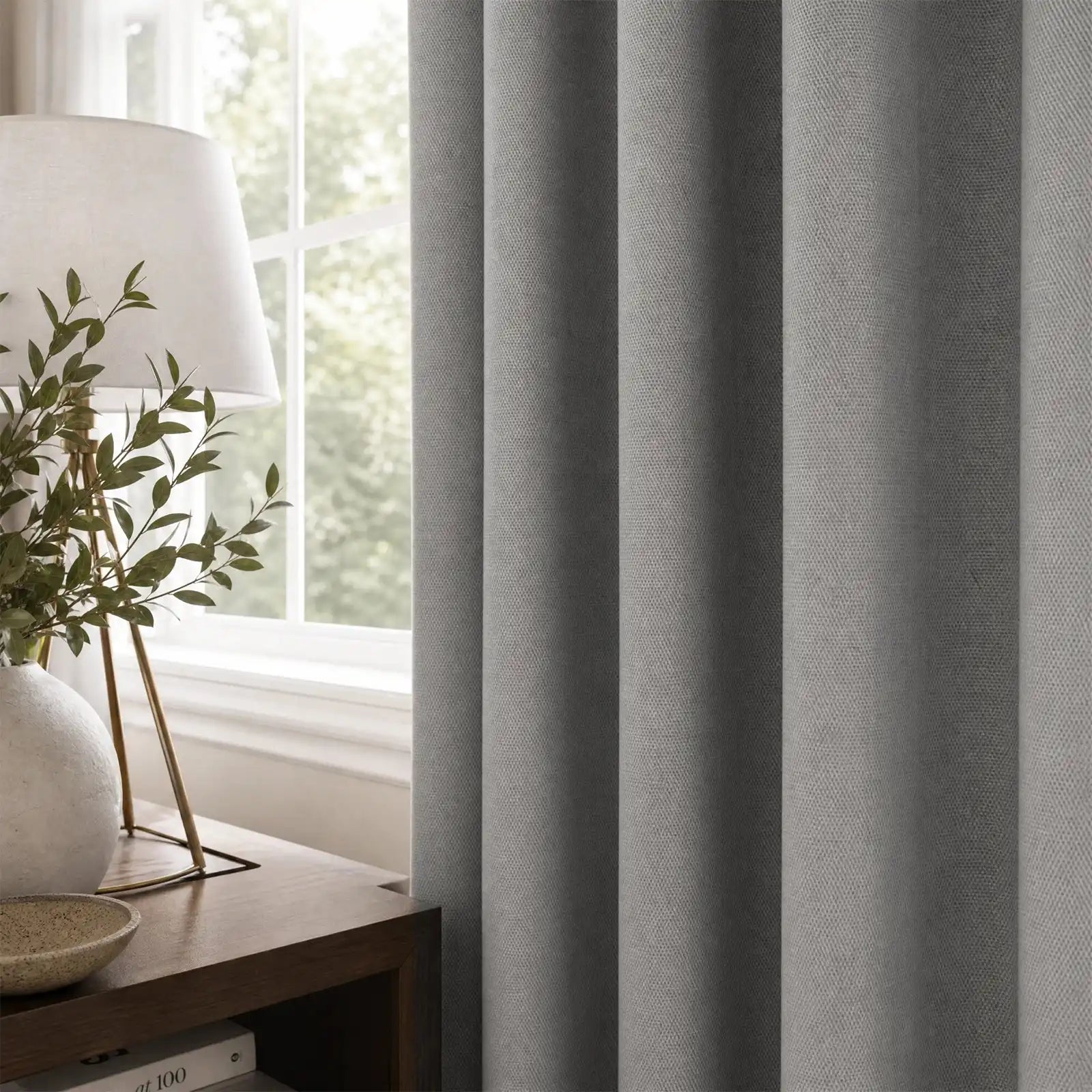 Cool gray Gavin curtains with soft pleats in a calm contemporary bedroom