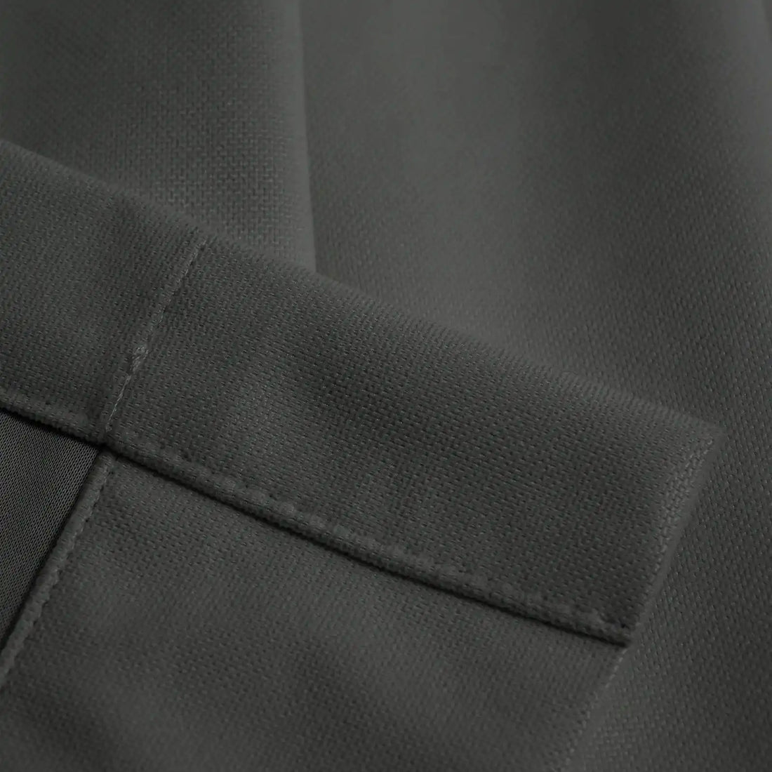 Close-up of dark gray Gavin curtain texture and tailored hem