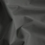 Macro detail of dark gray Gavin curtain fabric arranged in soft folds