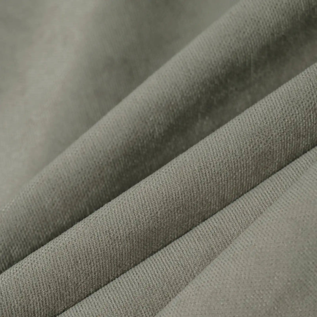 Macro detail of gray brown Gavin curtain fabric arranged in soft folds