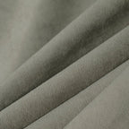Macro detail of gray brown Gavin curtain fabric arranged in soft folds