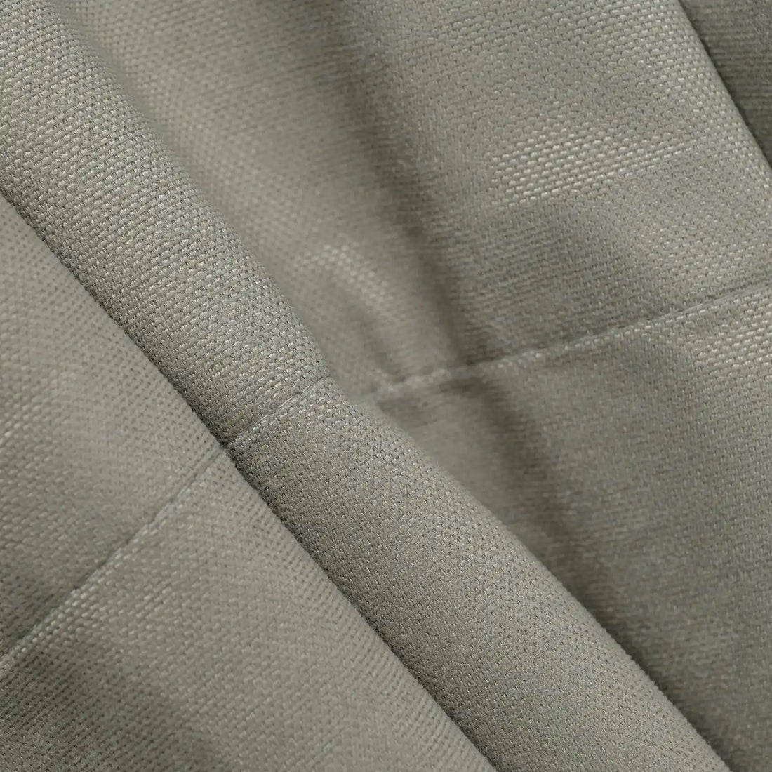 Close-up of gray brown Gavin curtain texture and tailored hem
