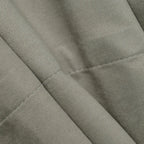 Close-up of gray brown Gavin curtain texture and tailored hem