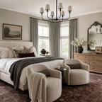 Gray Brown Gavin curtains framing a bright neutral bedroom with brass rods
