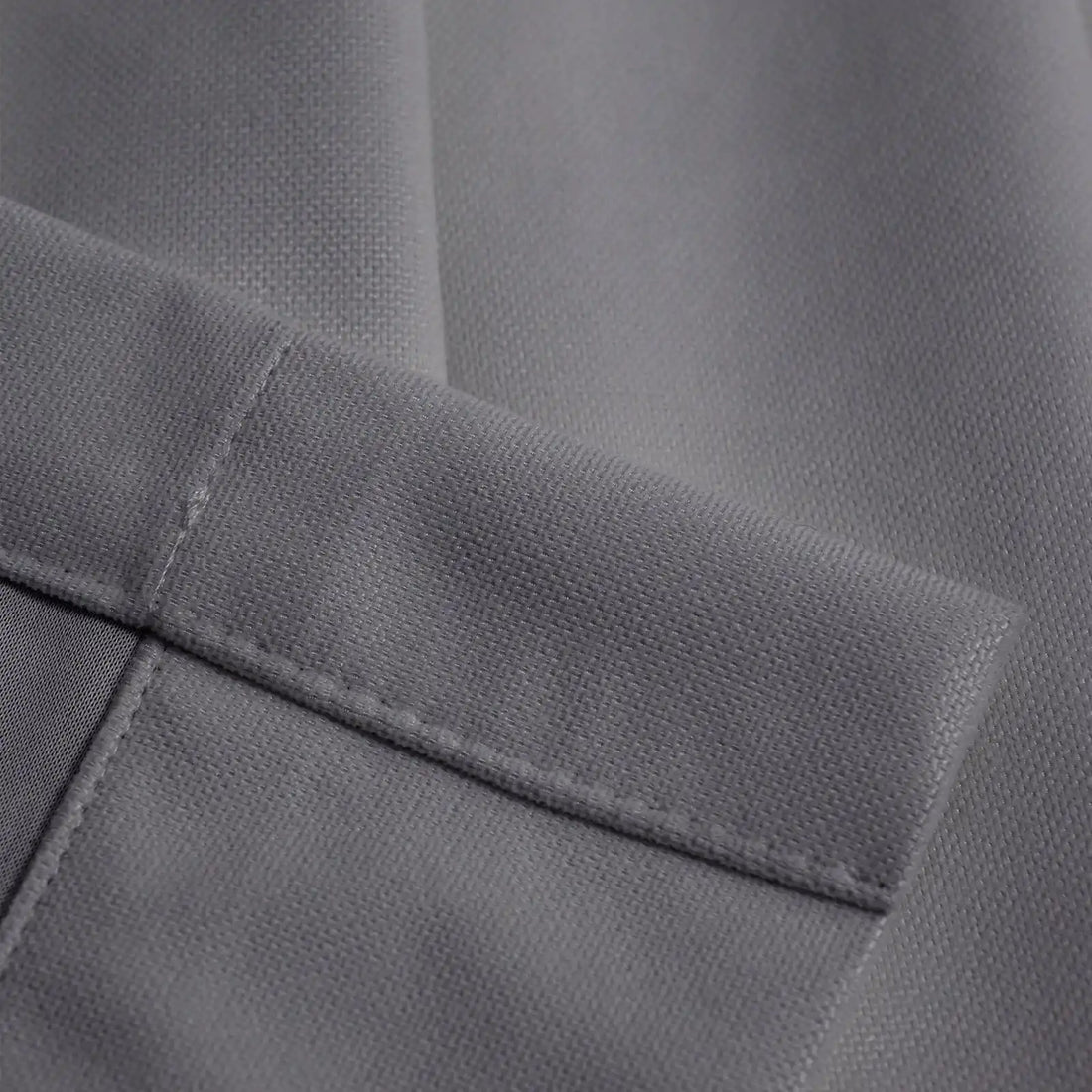 Close-up of purplish gray Gavin curtain texture and tailored hem