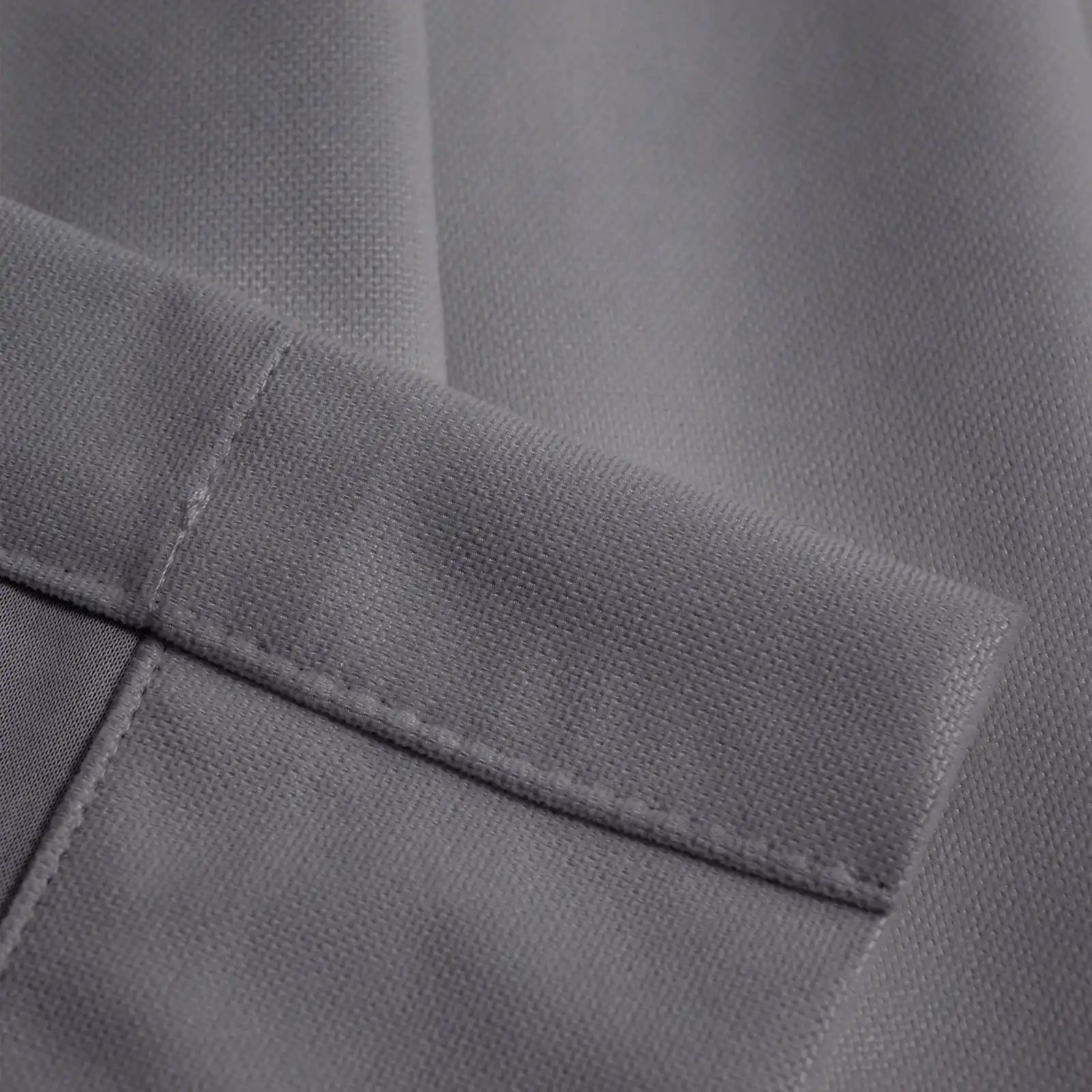 Close-up of purplish gray Gavin curtain texture and tailored hem