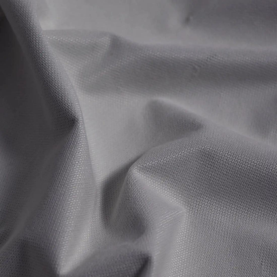 Macro detail of purplish gray Gavin curtain fabric arranged in soft folds