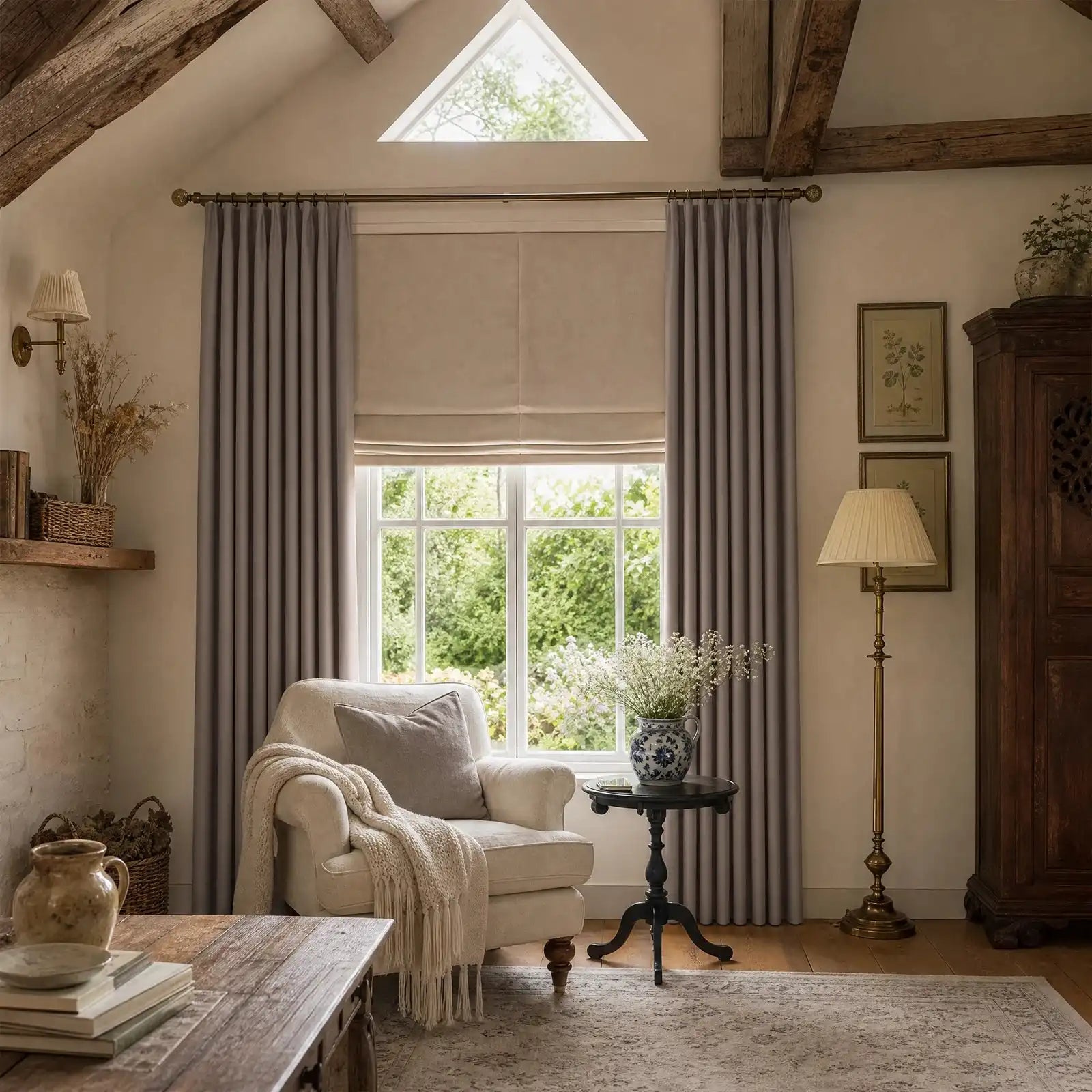 Purplish gray Gavin curtains framing a bright neutral bedroom with brass rods