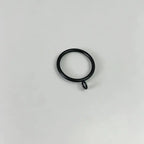 Close-up of black steel curtain rings with attached loops, used for hanging curtains, shown on plain white background