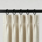 Set of two black steel curtain rings with loops, displayed on white surface, suitable for curtain hanging accessories in home decor