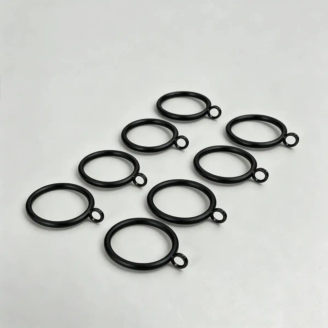Set of 20 black steel curtain rings with small attached loops for hanging curtains, ideal for window treatments, SKU: AGPC70-1