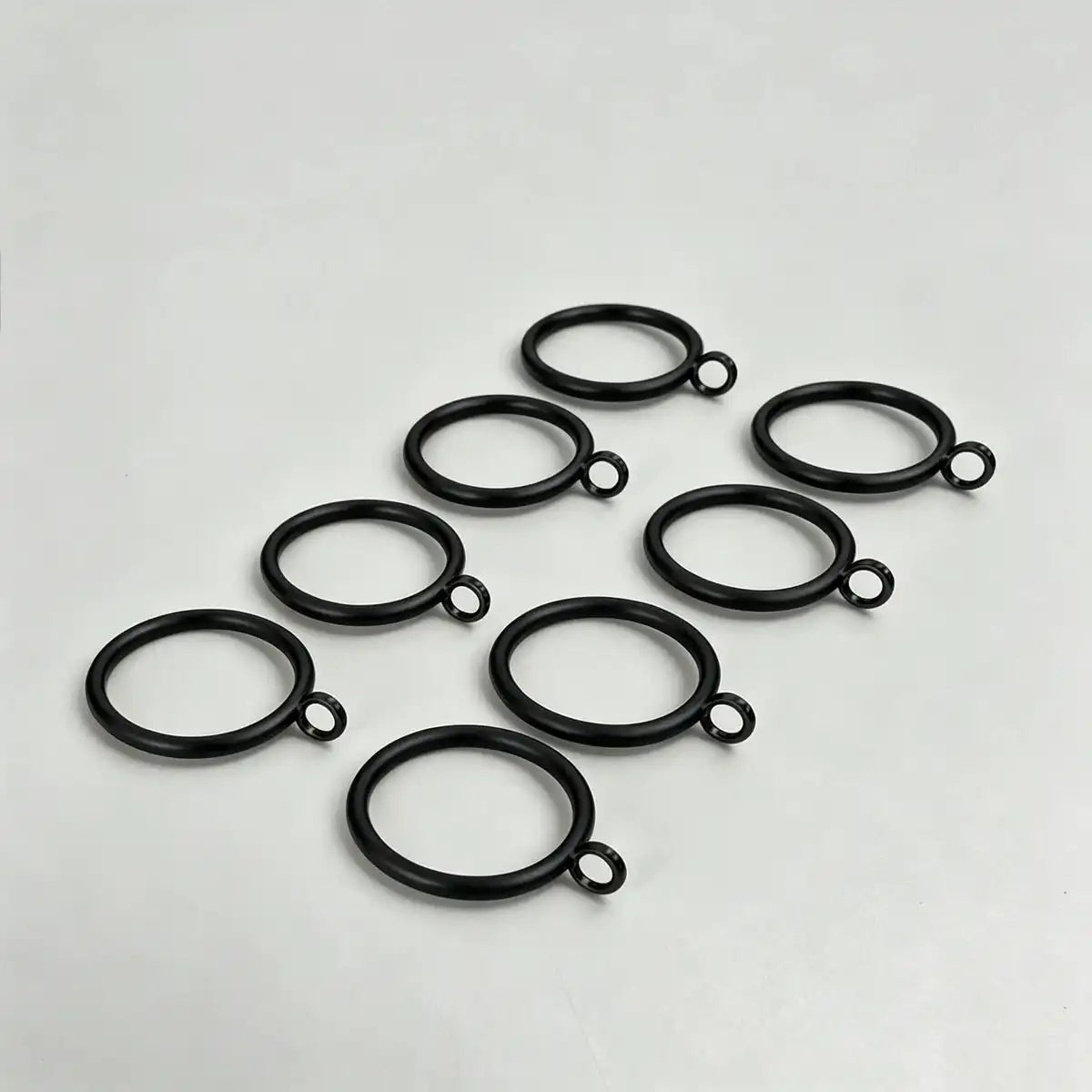 Set of 20 black steel curtain rings with small attached loops for hanging curtains, ideal for window treatments, SKU: AGPC70-1