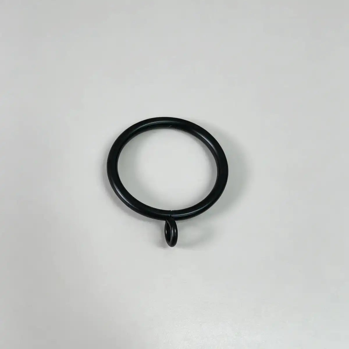 Black steel curtain ring with small attached loop for hanging curtains, used in home decor, set of 20pcs, on plain white background