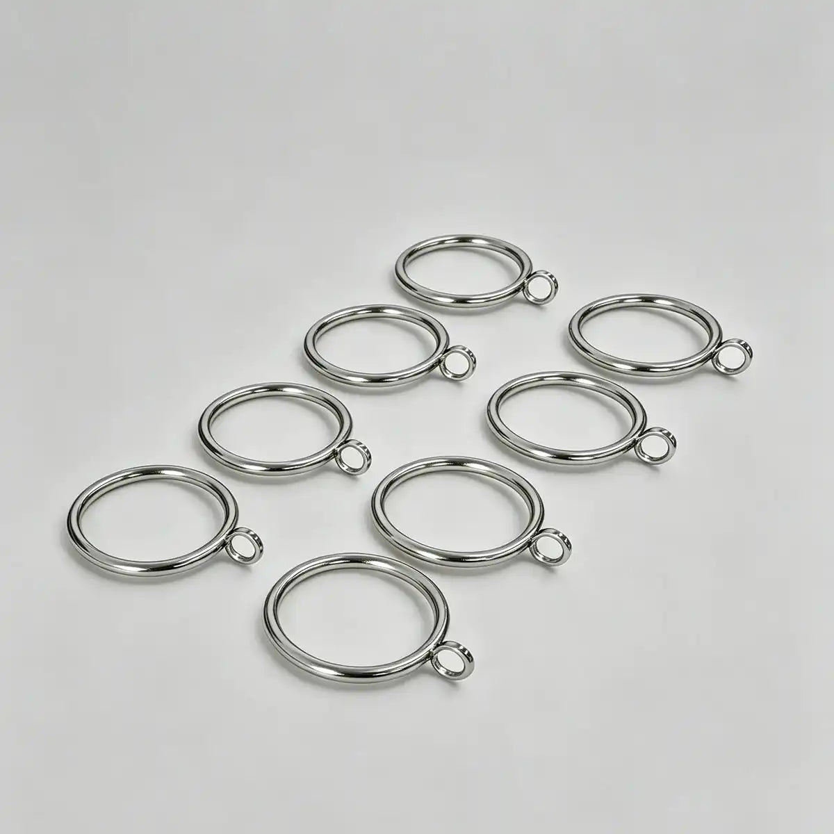 Set of 20 stainless steel curtain rings with small loops for hanging curtains, ideal for home decor and window treatments