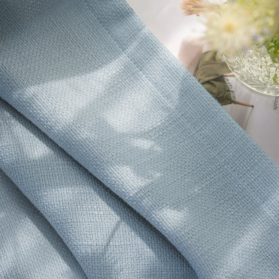 Close up fabric slub texture of Blue Gray John Linen Texture Cotton Curtains with natural lighting effects