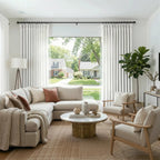 White John Linen Texture Cotton Curtains framing a large living room window with a scenic street view