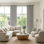 Light Gray John Linen Texture Cotton Curtains dressing large arched windows in a sunlit neutral living room